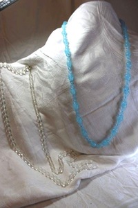 lot 18 image: (2) Sterling Silver glass bead necklaces. Both clasps marked Sterling on sides. Blue 38L, Clear 40L
