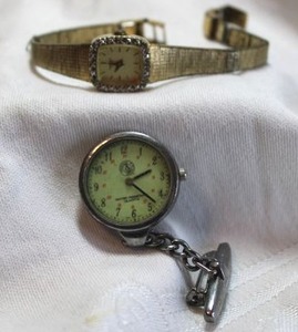 lot 26 image: Diamond jewelry Vintage Caravelle diamond watch. Has quarter-hour diamond markers. Band in poor condition. Includes Prestige Medicals nurse watch pin.