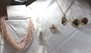 lot 39 image: Jewelry Signed jewelry. Includes Loft multi-strand blush necklace on card (Orig $44.50), Ciner earrings, Trifari flower pin, 1928 necklace 22L