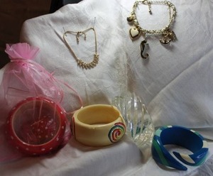 lot 45 image: Jewelry Selection of bangle bracelets. Includes an acrylic MCM clear bracelet plus