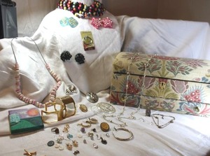 lot 47 image: Jewelry Fashion jewelry assortment. Includes necklaces, earrings and Carpet bagger style fabric covered jewelry box with tray insert and bottom drawer. Good shape. 12x9x6.5