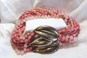 lot 48 image: Sterling Silver jewelry Sterling Silver clasp in leaf form on a torsade necklace. Strands of Rose quartz, Pin Quartz, Pink Glass , plus. Marked sterling on back of leaf clasp. 14L