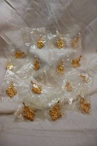 lot 63 image: (15) Gold-plated nugget style pendants. 1.25L