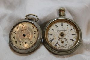 lot 64 image: (2) Vintage pocket watches Ingersoll USA and Hampden Watch. Both need attention