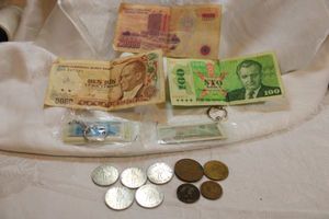 lot 65 image: International currency. Includes Turkey & Czechoslovakia bills, Mexican coins, Tokens, plus