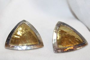 lot 91 image: Sterling Silver and brass heavy earrings. Marked Brass JEC Ster