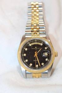 lot 93 image: HourGlass date adjust watch with diamond markers and two tone metal link band. Diamonds tested