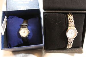 lot 99 image: (2) Omax GlimmerLux watches in boxes