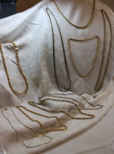 lot 133 image: (9) Gold-plated and other necklaces.