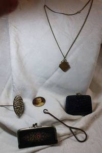 lot 144 image: Victorian collectibles. Includes oversize hat pin 10.5L, Celluloid baby photo, needlepoint change purse, button hook watch fob