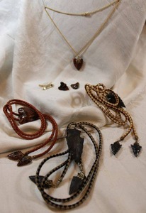 lot 148 image: (3) Arrowhead bolo ties with arrowhead tips. Includes other arrowhead items