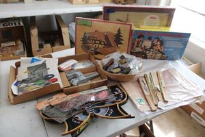 lot 202 image: Crafts leather making supplies, butterflies, button making kit, butterflies, cowboy boot keychains, wood crafts