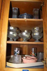 lot 208 image: Light blue glassware, Crystal Dessert bowl set sticker says luminarc, Smurf glasses, Flintstone glasses, and vintage baby food warmer dish