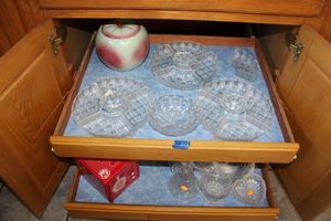 lot 212 image: Sectioned clear crystal serving dishes, apple cookie jar, Valentines and heart shaped cake pans, baskets and more