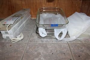 lot 462 image: Kitchen Pyrex casserole dishes, and under counter fluorescent lights