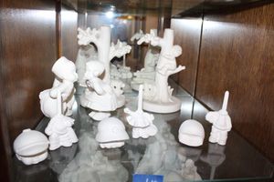 lot 610 image: Unfinished ceramics girl and boy figurines