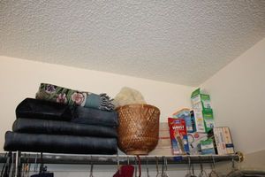 lot 544 image: Healthcare items Wrist stabilizer, Polident, massager, books, and support pillows