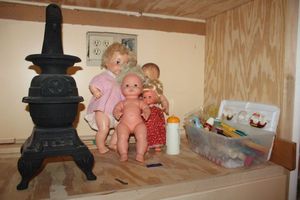 lot 510 image: Vintage toy dolls, ceramic antique style stove, and craft supplies