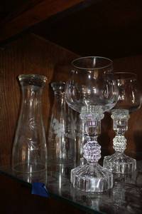 lot 630 image: Crystal pedestal votive holders and tall etched glass beer glasses