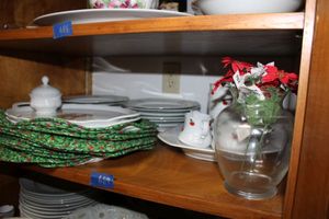 lot 689 image: Red and white dishes with Christmas platter and placemats