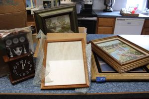 lot 252 image: Paintings, photo frames and clock with hutch design