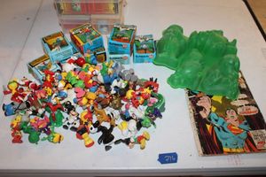 lot 276 image: Vintage toy characters, Smurfs, Flintstones molds, and Superman Comic book