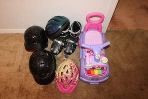 lot 289 image: kids lot toddler car, inline skates, and helmets