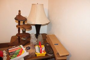 lot 291 image: Misc. items table lamp, math study books, wolf tail, Auto Theft Task Force bars (3)