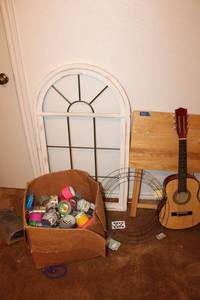 lot 302 image: Misc. items Window wall art, TV tray, kids guitar, wire wreathes, and duct tape