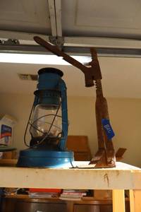 lot 826 image: Vintage bottle cap press and lantern