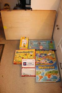 lot 519 image: Long wooden folding table and games and shown