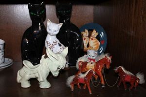 lot 644 image: Home dcor ceramic horses with chains, cat figurines, and more