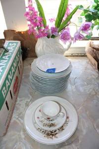 lot 666 image: Single place setting by Noritake, plate stands (no hardware), and ceramic vase with flowers
