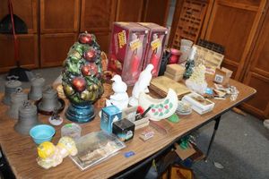 lot 674 image: Misc. lot ceramic bells, baby sugar shaker, vintage photo album, Pyrex hurri-candles, and more