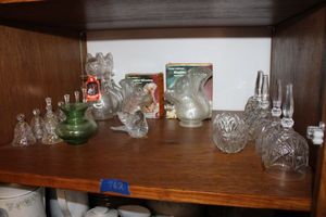 lot 762 image: Glass squirrel nut pourers, blown glass bird, lead crystal bells (chains need re-attached)