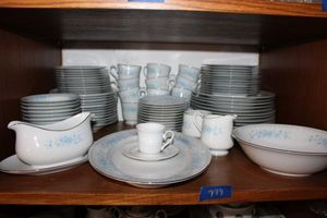 lot 779 image: Dish set Diplomat by Sango with blue flowers
