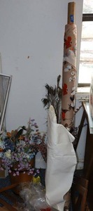 lot 668 image: Artificial flowers and vintage fabric rolls