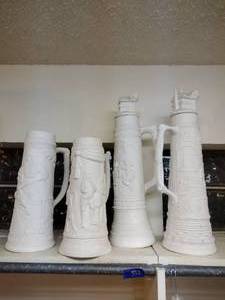lot 562 image: Unfinished ceramics steins - 4 total