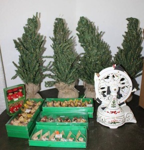 lot 1 image: Porcelain Christmas Carousel music box, Mini trees, and ornaments (mostly wooden and made in Europe)