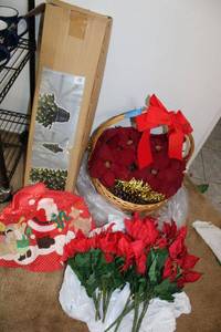 lot 113 image: Christmas tree with tree skirt, basket and Poinsettias