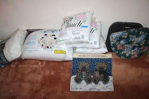 lot 77 image: Unopened pillows with decorative bear panel plus foam cushions