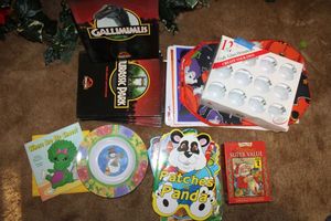 lot 138 image: Misc. lot Fall and Christmas placemats, kids books, and clear glass ornaments