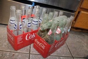 lot 152 image: Vintage soda bottles Dr. Pepper and Welchs