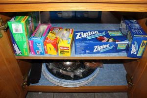 lot 165 image: Kitchen storage bags, serving trays and metal strainers