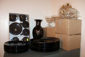 lot 14 image: New Years celebration dishes Black dish set, black and gold vase, Crystal bowls with gold trim, Golden candle holders