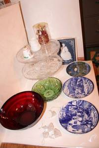 lot 21 image: Christmas plates, red and green decorative bowls, crystal cake pedestals, Villeroy & Boch Mettlach blue and white plaque LIEBE, and more