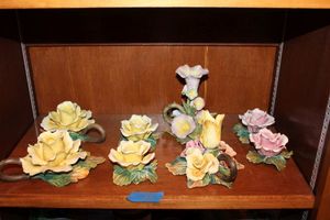 lot 25 image: Ceramic flowers in yellow and pink (one marked made in Italy)