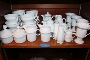 lot 37 image: White mugs, cups and tea set