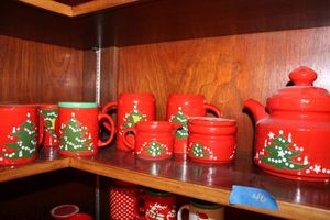 lot 40 image: Red teapot set and mugs with Christmas trees