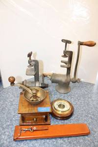 lot 149 image: Vintage items coffee grinder, barometer, meat grinders, and Slide rule